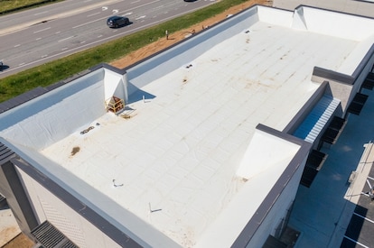 Drone Images of TPO Commercial Roof With Some Metal Panels and a Clock Cupola 